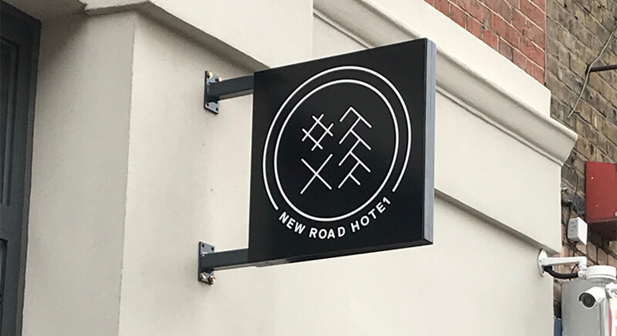 New Road Hotel Sign mounted on the exterior wall