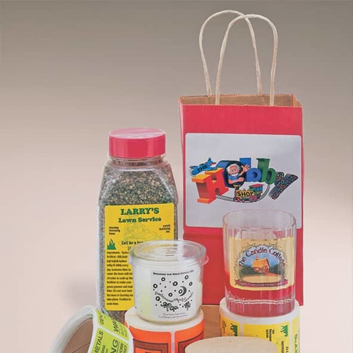 rolls of custom sticker labels on spices, bags, and containers