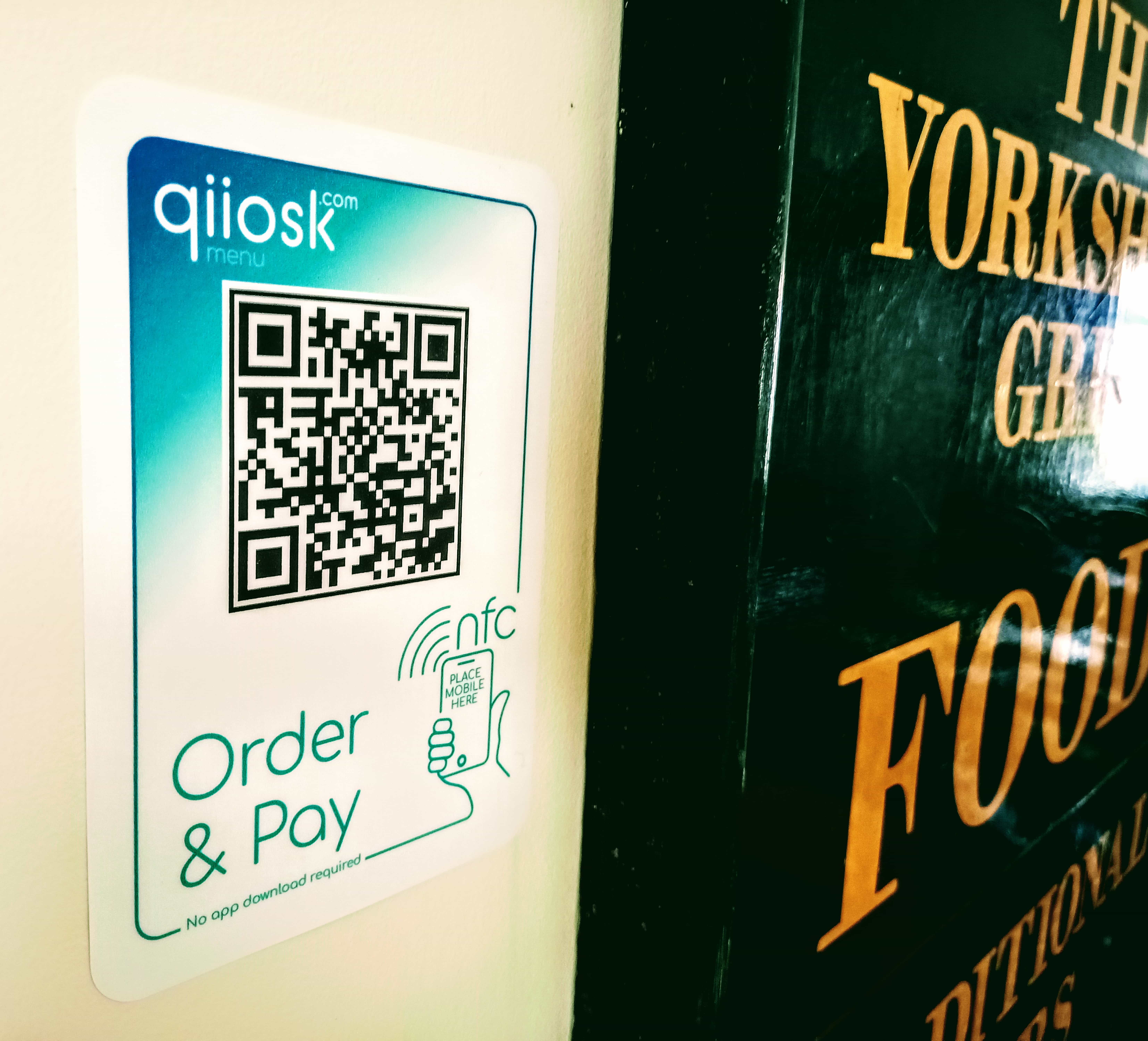 Order and pay with a QR code wall sign
