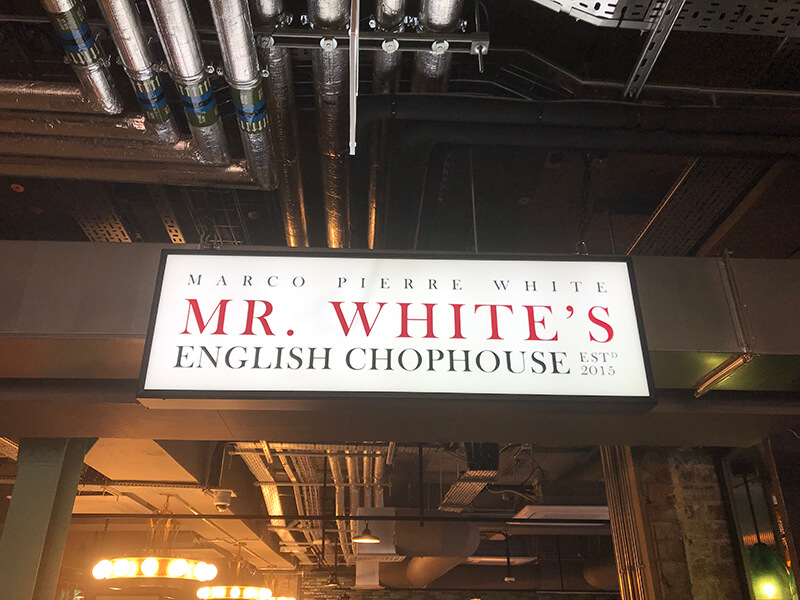 white sign for Mr White's english chophouse restaurant