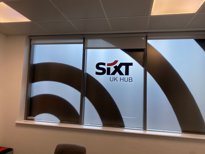 An image of a SIXT indoor window graphic that provides privacy