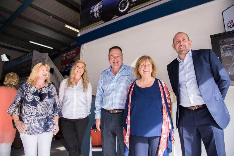 FASTSIGNS® Portsmouth team with FASTSIGNS UK Managing Director John Davies QFP