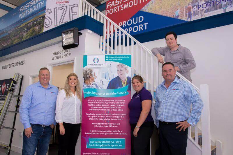 FASTSIGNS® Portsmouth team with Michelle Bowdidge from Portsmouth Hospitals Charity